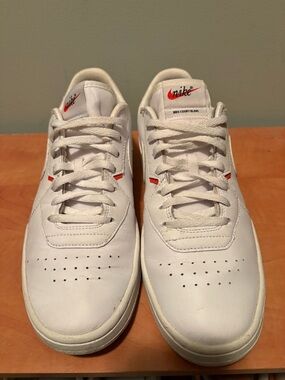 Nike Women’s White Leather Sneakers with Red Logo Accents
